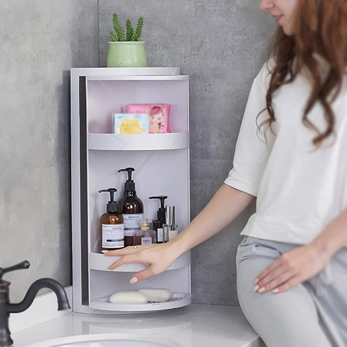 A 360-degree rotatable bathroom shower corner shelf with a sleek, modern design. The shelf is mounted in a shower corner and features multiple tiers for organizing toiletries. The sturdy construction includes drainage holes to prevent water accumulation, and the rotation mechanism allows easy access to all items. Shampoo bottles, soap, and other bathroom essentials are neatly arranged on the shelves.